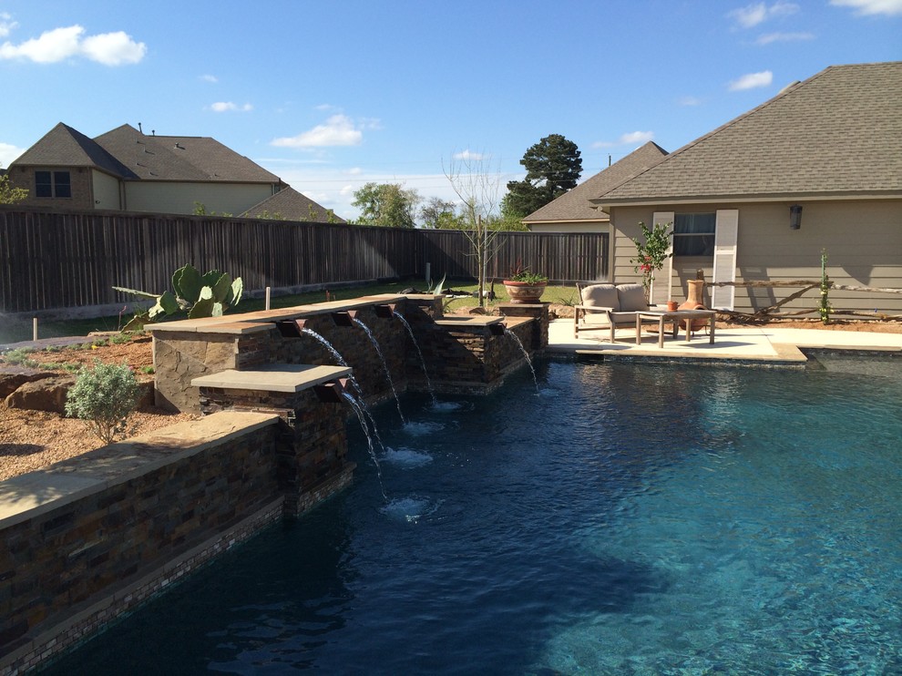 Inspiration for a large rustic backyard rectangular natural hot tub remodel in Houston