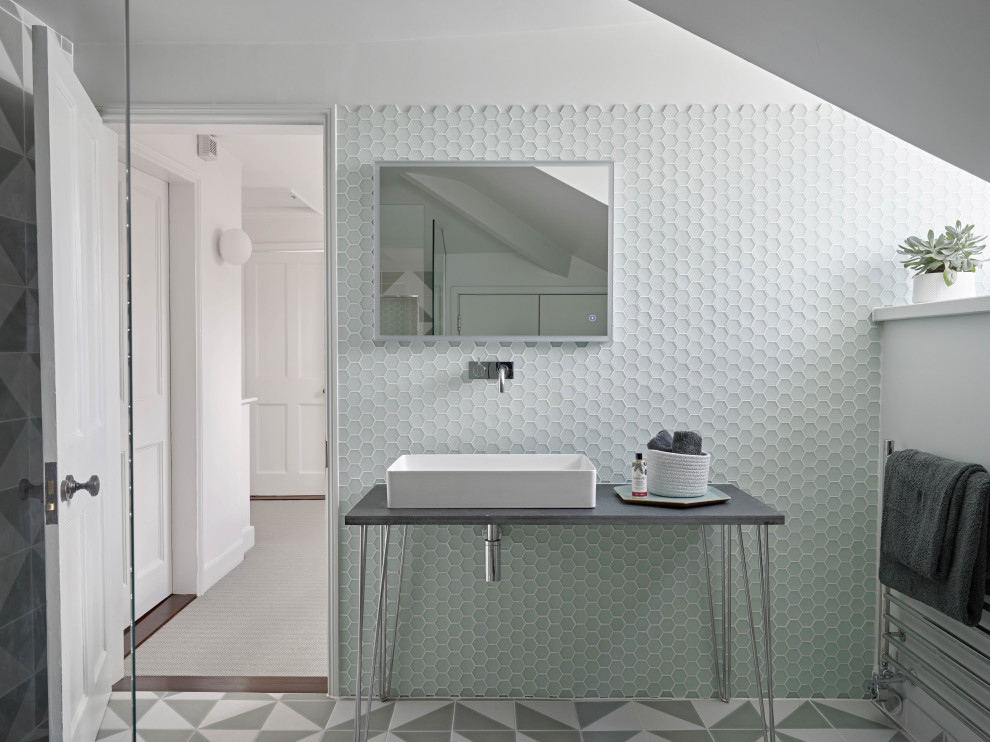 Inspiration for a scandinavian 3/4 bathroom in Devon with a wall-mount toilet, porcelain floors, white floor, an open shower, grey benchtops, a niche, a single vanity, a freestanding vanity, green tile, glass tile, white walls and a vessel sink.