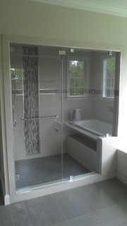 glass shower door with white and gray tile - contemporary