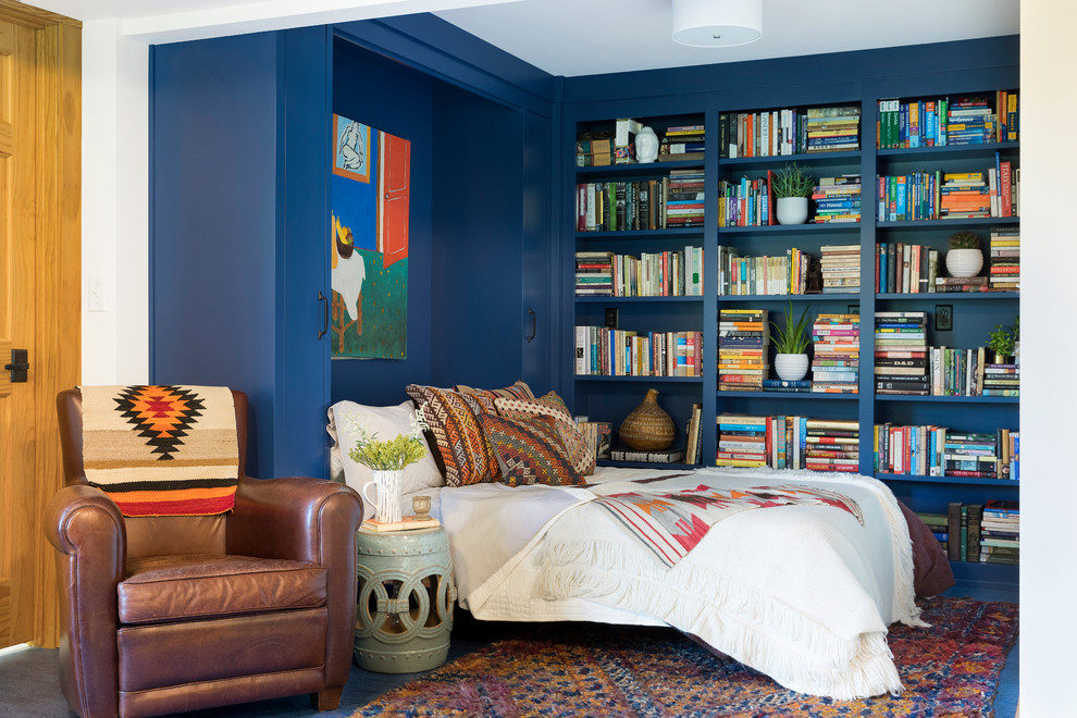 Inspiration for a bedroom in Minneapolis with blue walls.