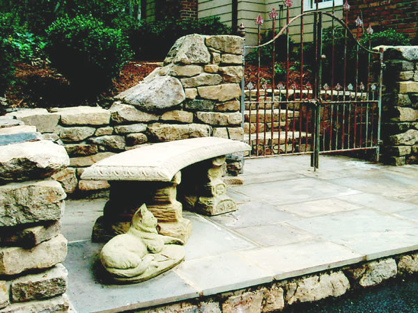 Mid-sized traditional backyard garden in DC Metro with a garden path and natural stone pavers.