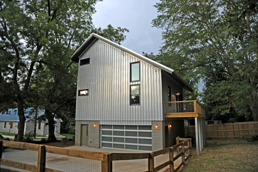 Inspiration for an industrial exterior in Atlanta with metal siding.
