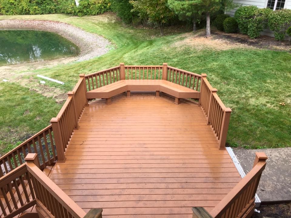 Inspiration for a large backyard deck remodel with no cover