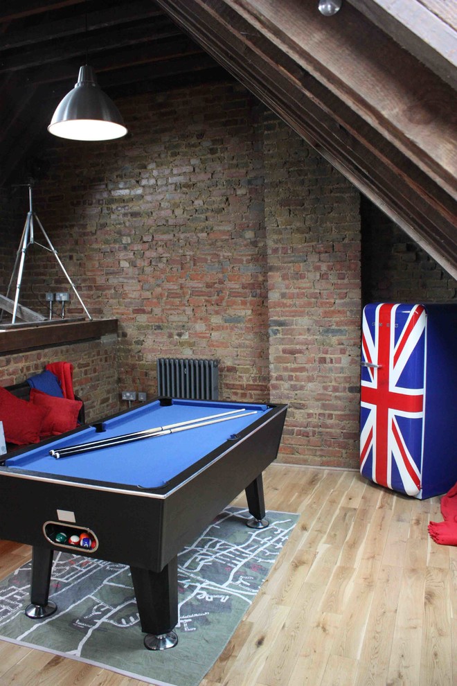 Design ideas for an industrial family room in London.