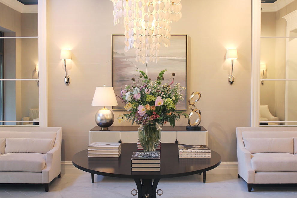 Example of a transitional foyer design in Charlotte with gray walls