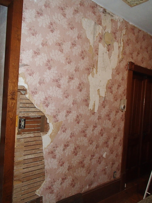 Covering up a damaged wall? Ideas?