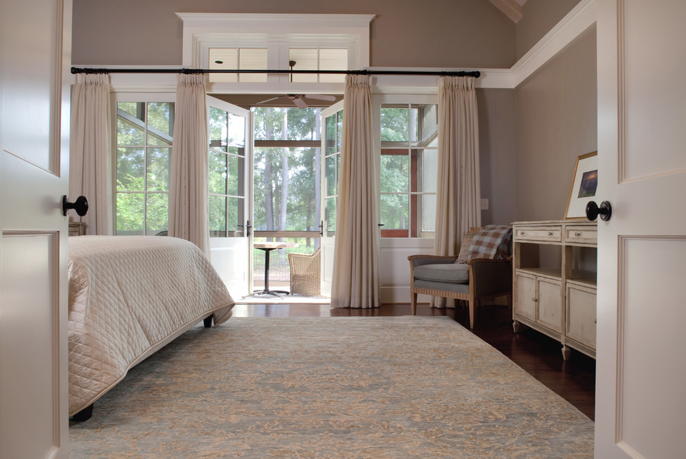 Example of a mid-sized classic master dark wood floor bedroom design in Charleston with beige walls