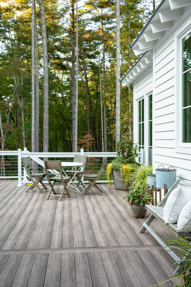 This is an example of a backyard and ground level deck in Other.