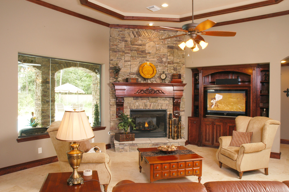 Design ideas for a large traditional formal open concept living room in Houston with beige walls, carpet, a standard fireplace, a brick fireplace surround and a built-in media wall.