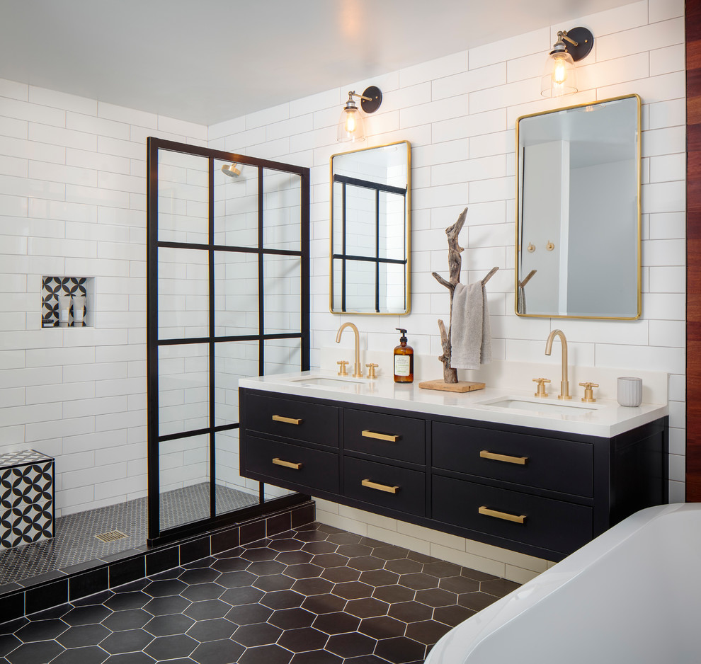 Mid-sized contemporary master bathroom in San Diego with flat-panel cabinets, black cabinets, a freestanding tub, an open shower, a one-piece toilet, white tile, porcelain tile, white walls, cement tiles, an undermount sink, engineered quartz benchtops, black floor, an open shower and white benchtops.