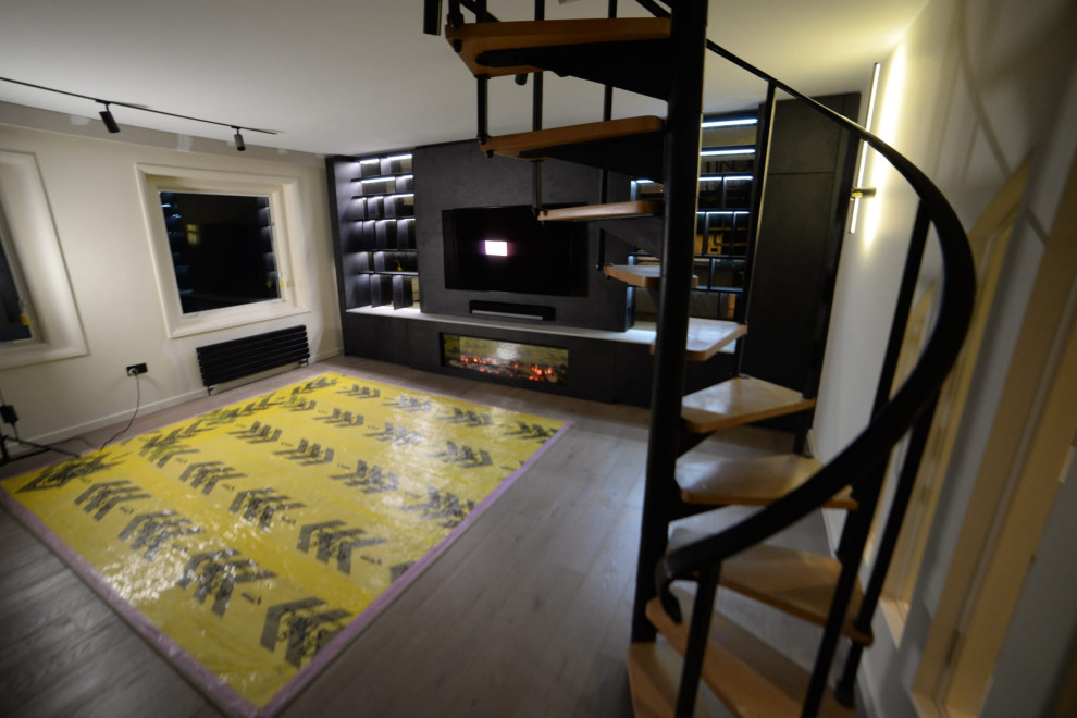Modern Living Room with Bespoke Shelf Unit and Spiral Staircase