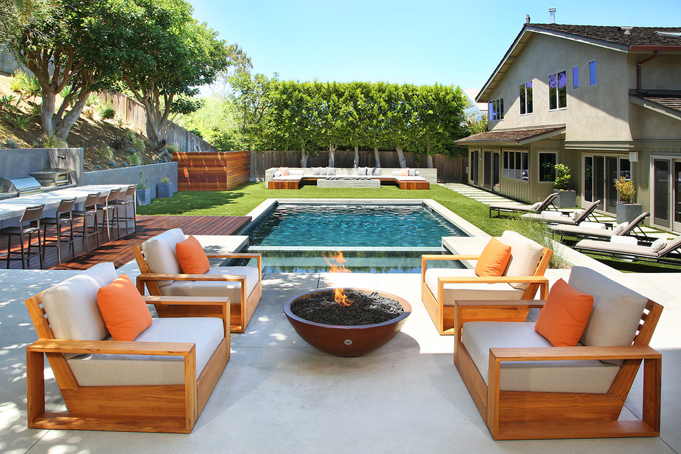Design ideas for a large contemporary backyard rectangular pool in Orange County.