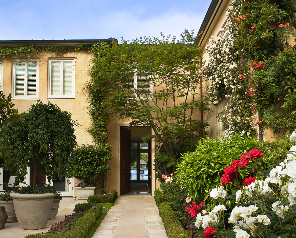 This is an example of a traditional entryway in San Francisco with a single front door and a dark wood front door.