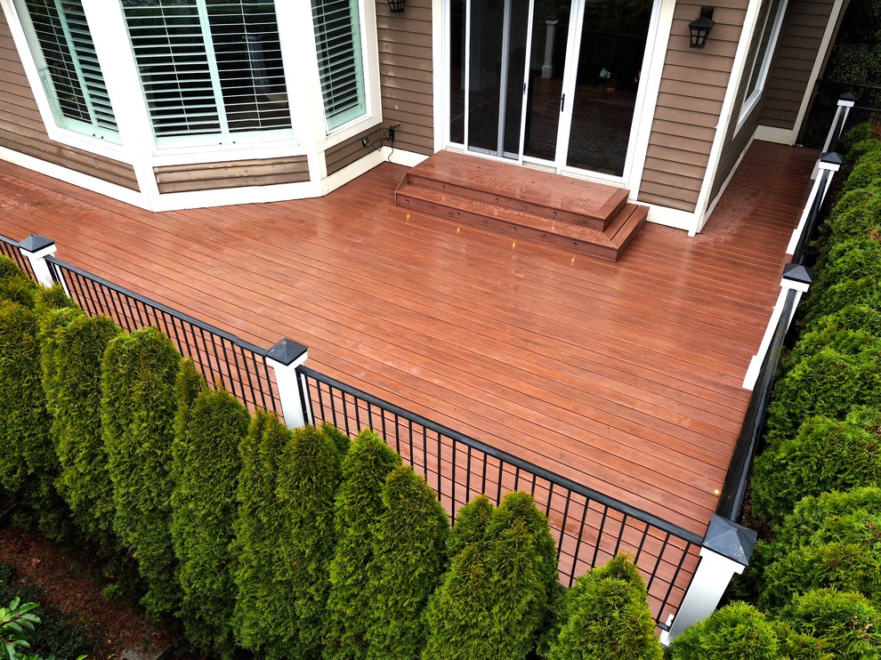This is an example of a large contemporary backyard deck in Seattle with no cover.