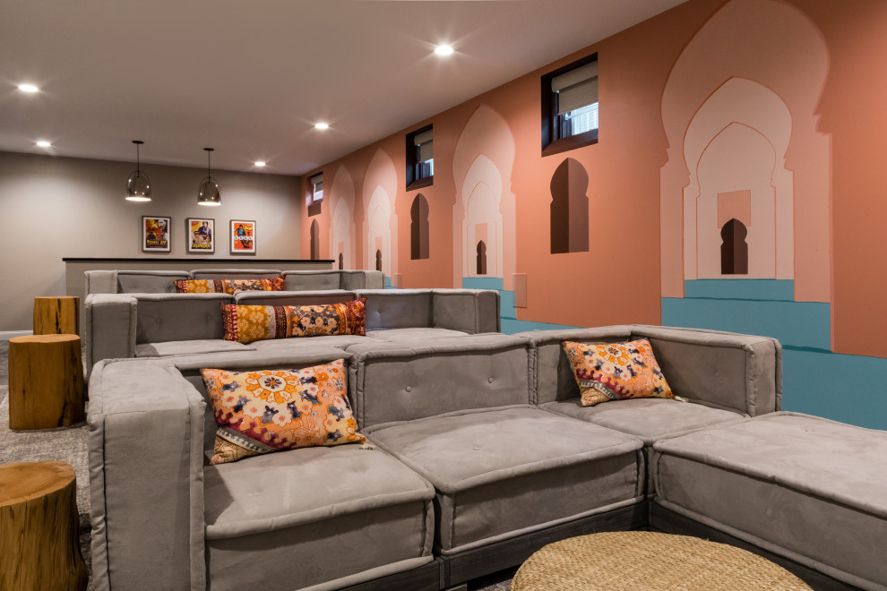 Transitional home theatre in Boston with orange walls, carpet and grey floor.