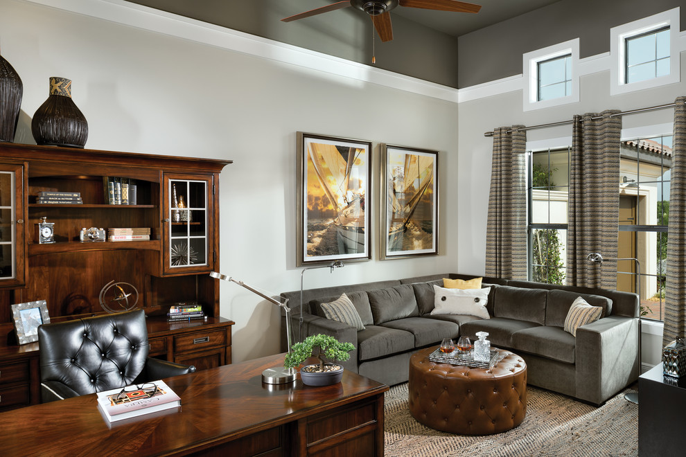 Photo of an expansive mediterranean study room in Tampa with grey walls, carpet and a freestanding desk.