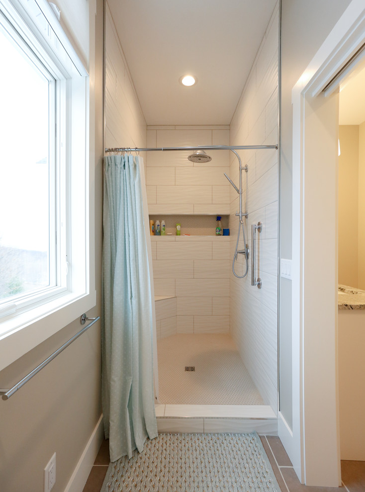 Inspiration for a large transitional master white tile and porcelain tile porcelain tile and brown floor alcove shower remodel with recessed-panel cabinets, white cabinets, a one-piece toilet and beige walls
