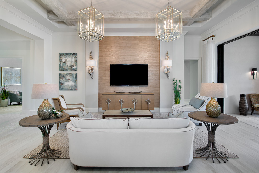 This is an example of a transitional open concept living room in Miami with a wall-mounted tv.