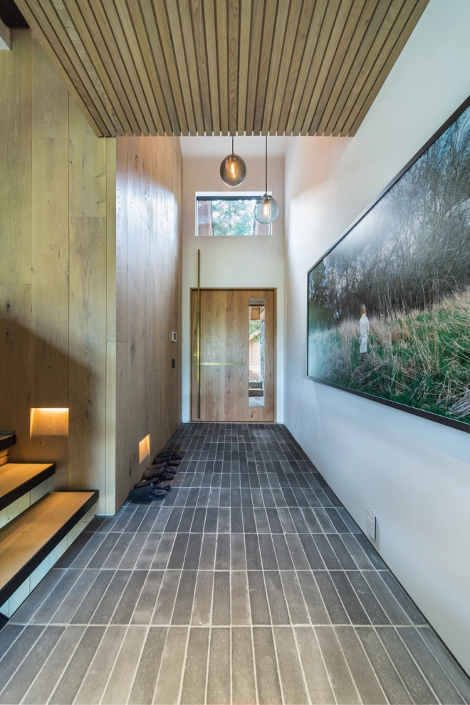Inspiration for a contemporary wood ceiling and wood wall entryway remodel in Vancouver