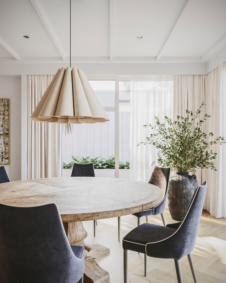 Inspiration for a mid-sized contemporary open plan dining in Sunshine Coast with white walls and light hardwood floors.