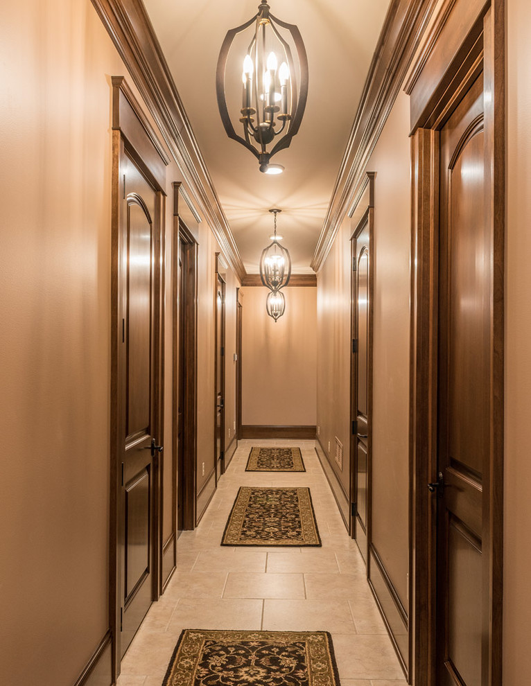 Photo of a large arts and crafts hallway in Other with beige walls and porcelain floors.