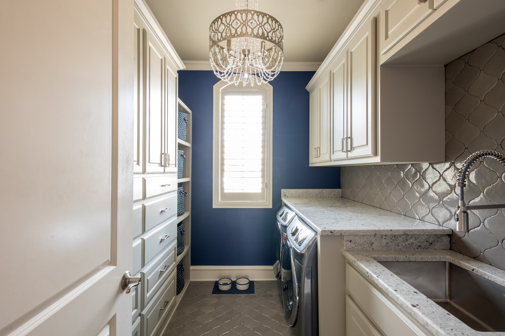 Inspiration for a mid-sized transitional galley dedicated laundry room in Dallas with an undermount sink, raised-panel cabinets, beige cabinets, granite benchtops, blue walls, ceramic floors and a side-by-side washer and dryer.