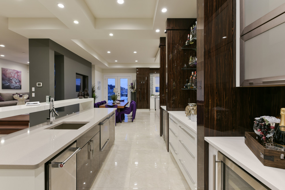 Inspiration for a modern home bar in Edmonton with an undermount sink, flat-panel cabinets and quartz benchtops.