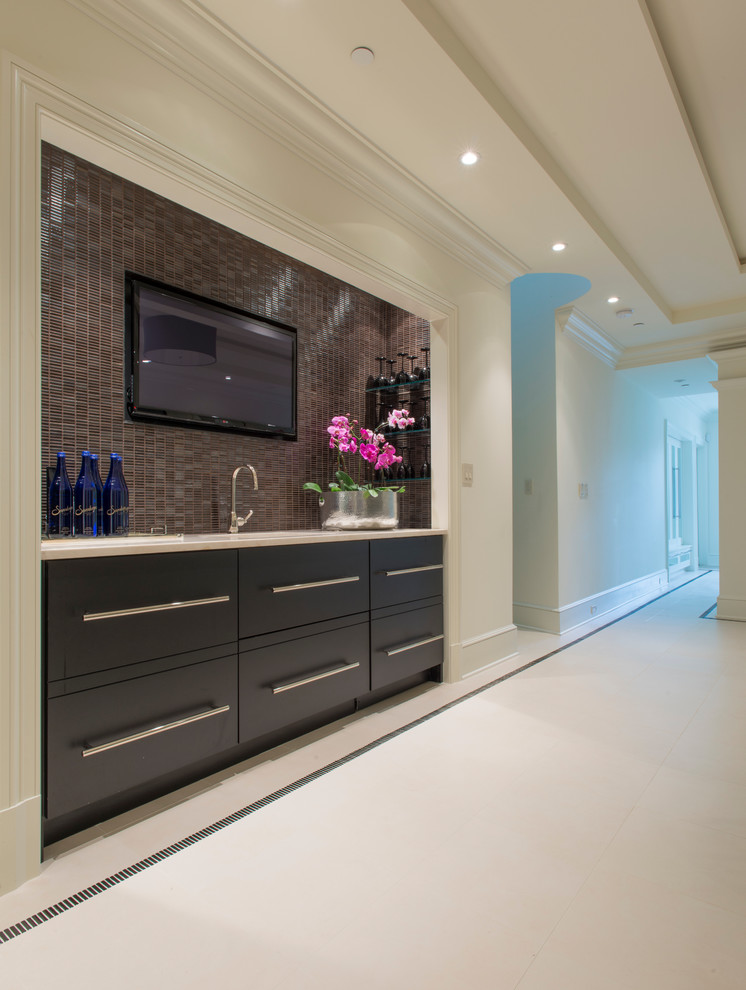 Design ideas for a mid-sized traditional single-wall wet bar in DC Metro with an undermount sink, flat-panel cabinets, black cabinets, marble benchtops, black splashback and mosaic tile splashback.
