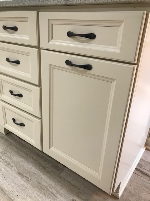 Mid-sized transitional galley porcelain tile and beige floor eat-in kitchen photo with an undermount sink, flat-panel cabinets, beige cabinets, granite countertops, multicolored backsplash, mosaic tile backsplash, stainless steel appliances, a peninsula and white countertops