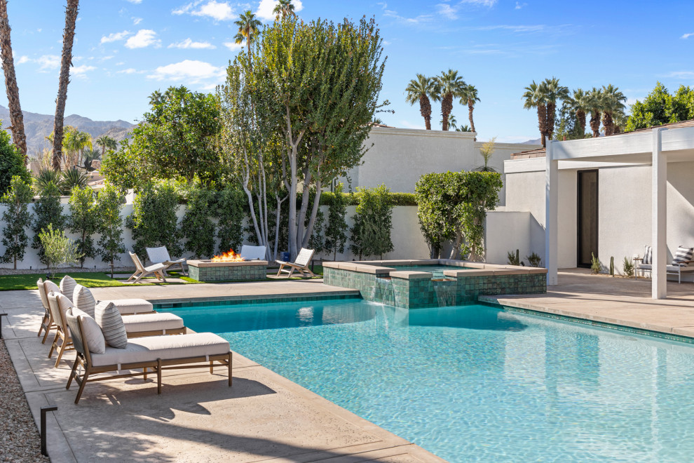 Example of a transitional backyard concrete and rectangular natural hot tub design