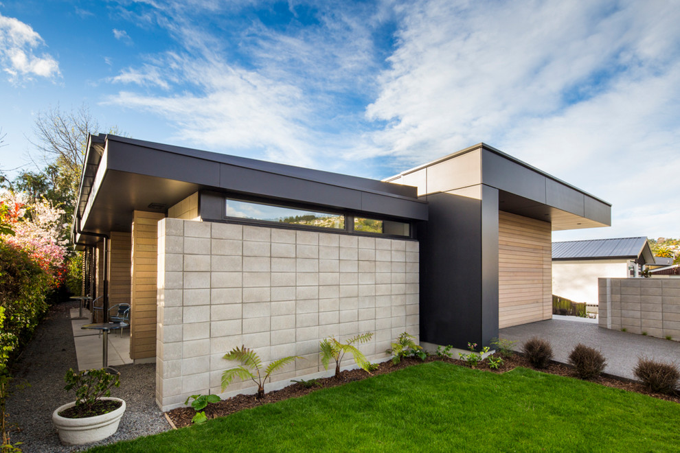 Contemporary one-storey exterior in Christchurch with wood siding.