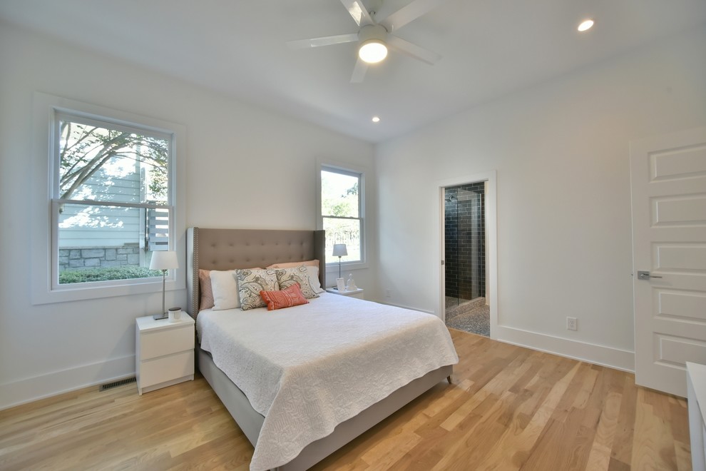 Design ideas for a mid-sized transitional master bedroom in Atlanta with white walls, light hardwood floors and no fireplace.