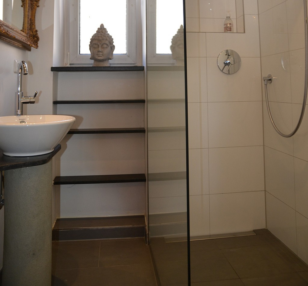 Photo of a small traditional 3/4 bathroom in Munich with brown cabinets, a curbless shower, white tile, white walls, porcelain floors, a vessel sink, concrete benchtops, black floor, a hinged shower door, brown benchtops, a single vanity and a freestanding vanity.