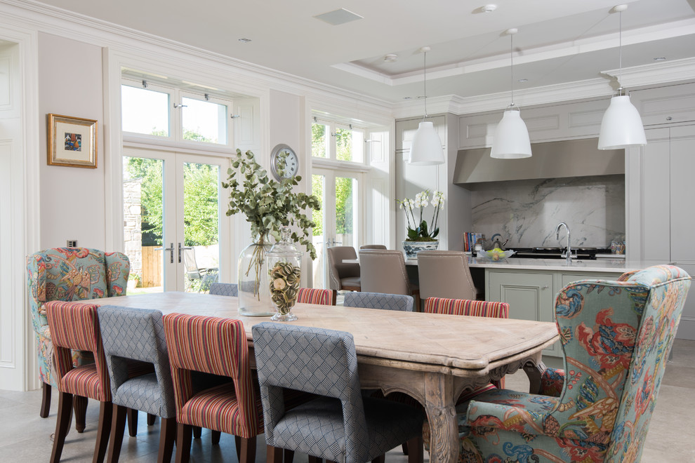 Photo of a traditional open plan dining in Belfast with grey walls, no fireplace and beige floor.