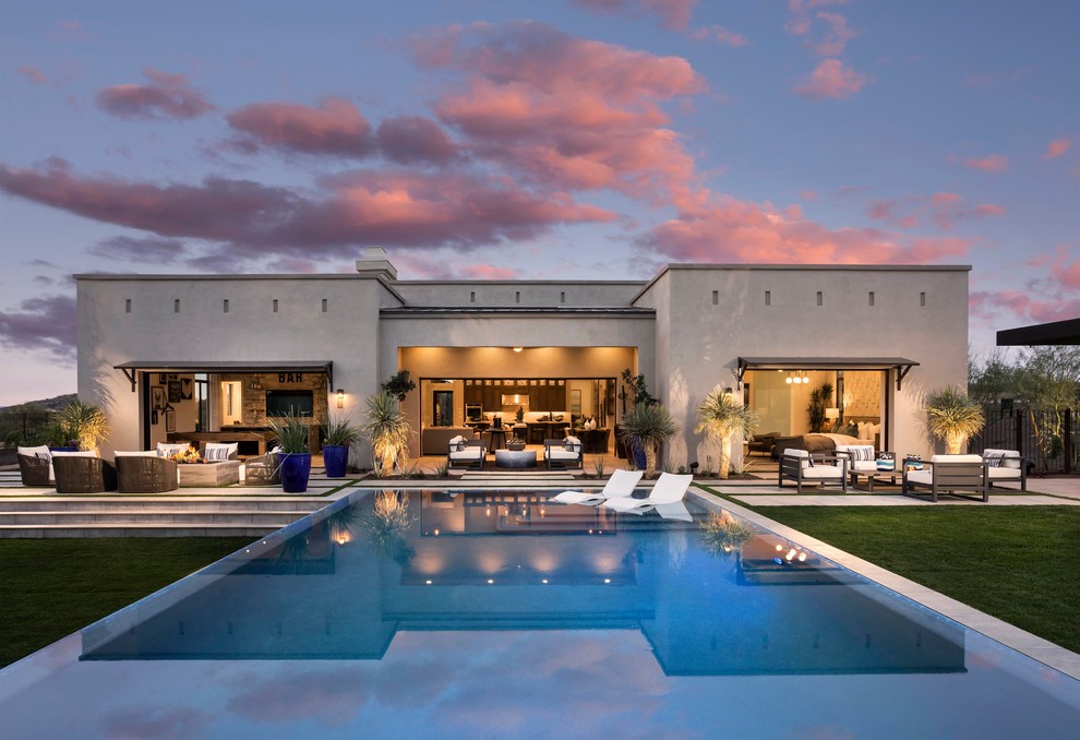 Inspiration for a contemporary backyard rectangular lap pool in Phoenix with tile.