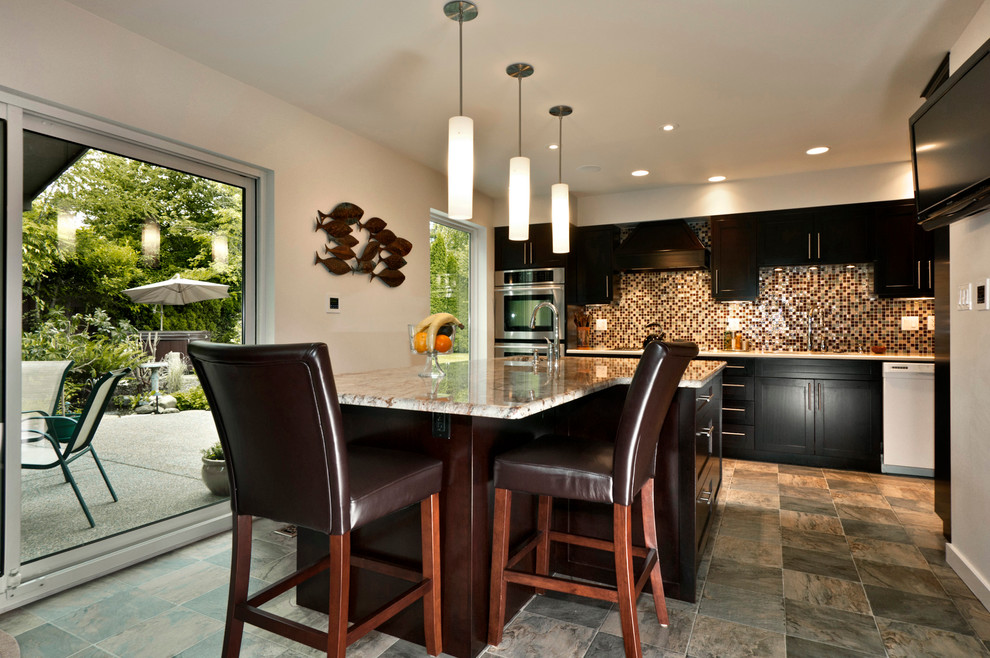 Inspiration for a large contemporary u-shaped separate kitchen in Vancouver with an undermount sink, shaker cabinets, dark wood cabinets, granite benchtops, multi-coloured splashback, glass tile splashback, stainless steel appliances, linoleum floors and with island.