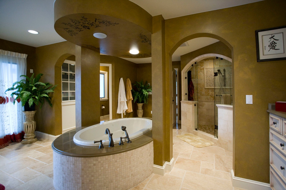 Inspiration for a large traditional master bathroom in Minneapolis with recessed-panel cabinets, beige cabinets, a drop-in tub, an alcove shower, beige tile, ceramic tile, brown walls, ceramic floors, an undermount sink and granite benchtops.