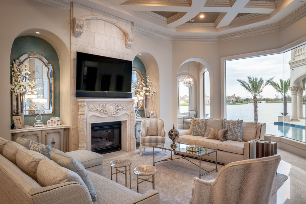 Large traditional formal open concept living room in Houston with beige walls, porcelain floors, beige floor and a standard fireplace.