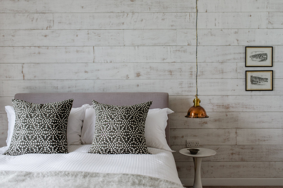 Inspiration for a large scandi bedroom in Cornwall with wallpapered walls.