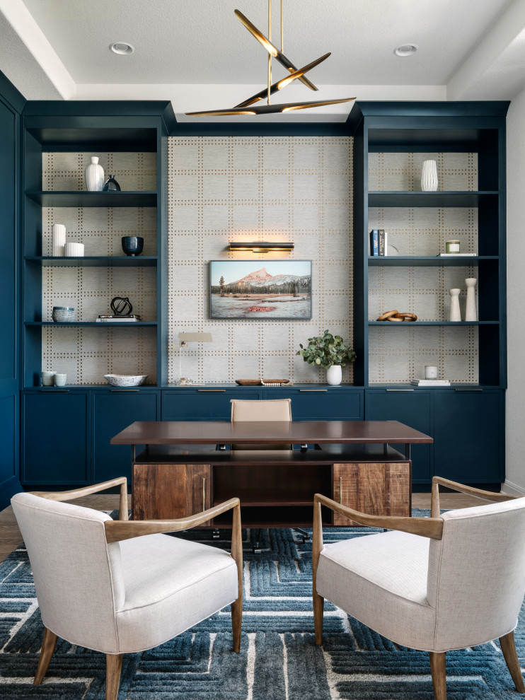 Example of a transitional home office design in Austin