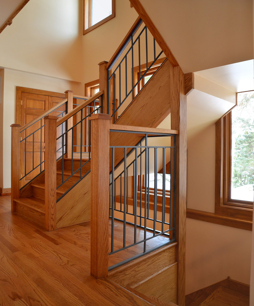 Photo of a contemporary wood staircase in Chicago with wood risers.