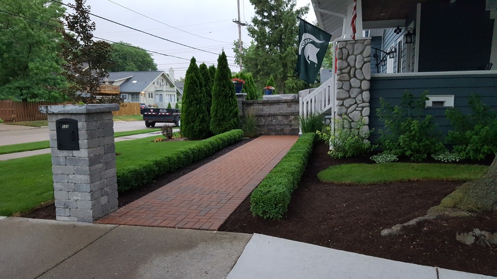 Design ideas for a modern front yard garden in Detroit with brick pavers and a garden path.
