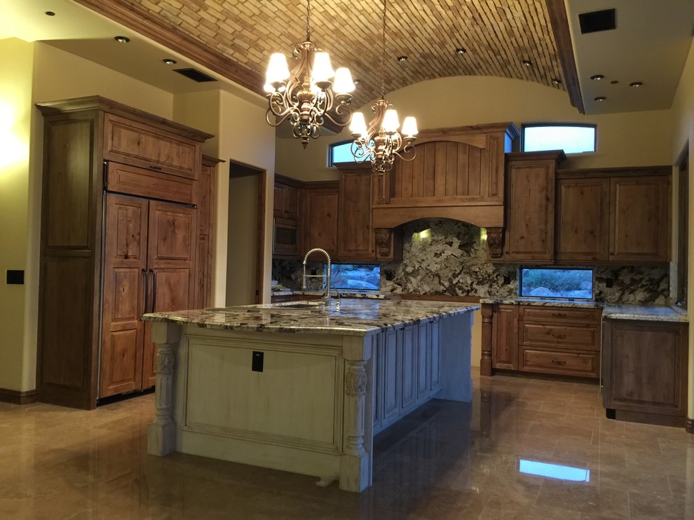 Open concept kitchen - large transitional u-shaped porcelain tile and beige floor open concept kitchen idea in Phoenix with an undermount sink, raised-panel cabinets, medium tone wood cabinets, quartz countertops, multicolored backsplash, stone slab backsplash, stainless steel appliances and an island