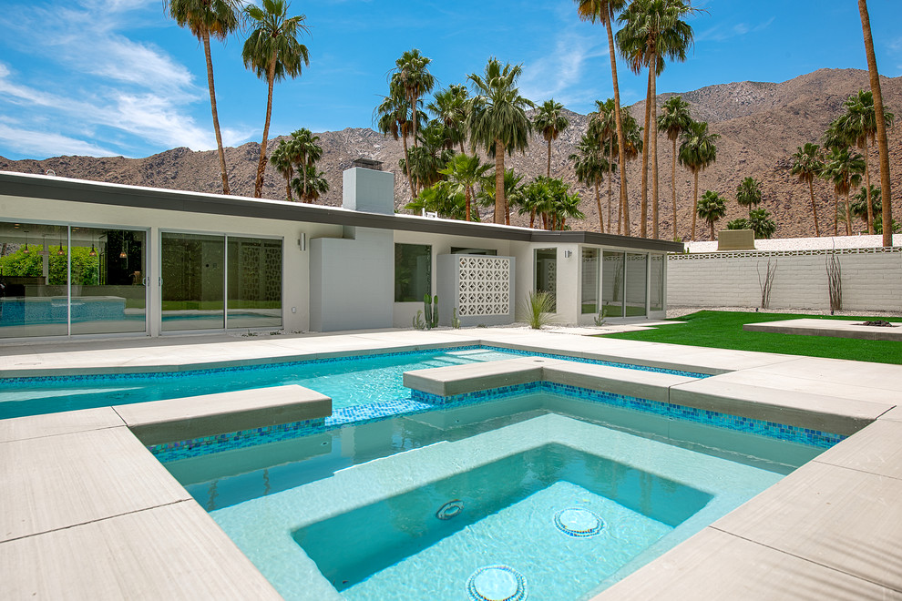 Design ideas for a midcentury pool in Other.
