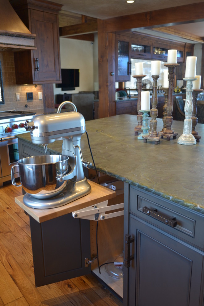 Photo of a country kitchen in Denver with a farmhouse sink and panelled appliances.