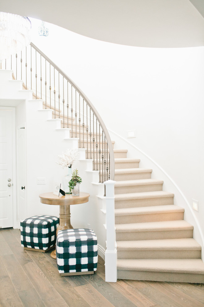 Staircase - mid-sized transitional dark wood floor staircase idea in Orange County with white walls