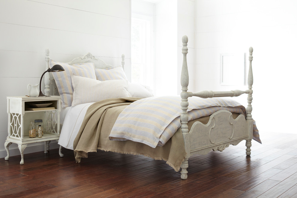 Inspiration for a mid-sized traditional bedroom in Other with white walls and dark hardwood floors.