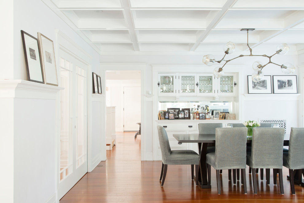 Inspiration for a beach style dining room in Los Angeles with white walls and dark hardwood floors.