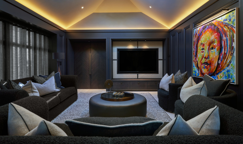 This is an example of a large transitional enclosed home theatre in Dublin with brown walls, marble floors, a built-in media wall and beige floor.
