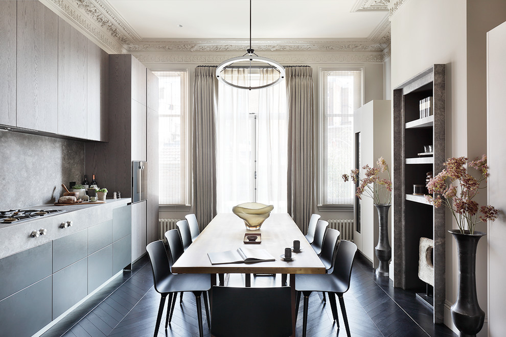 Inspiration for a transitional single-wall eat-in kitchen in London with flat-panel cabinets, black cabinets, grey splashback, dark hardwood floors, no island, black floor and grey benchtop.